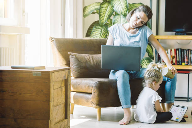 istock Mother and daughter; working, playing together 1616107871
