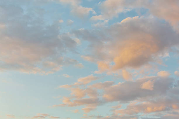 istock Panoramic view of clear blue sky and clouds, Blue sky background with tiny clouds. White and pearl fluffy clouds in the blue sky at sunrise. Atmosphere background or wallpaper 1616117719