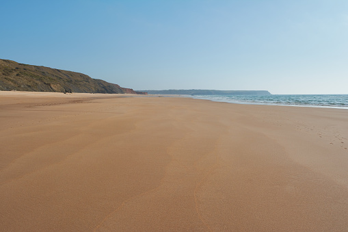 Endless sands of the Praia da Bordeira. West of the Algarve coast in Portugal