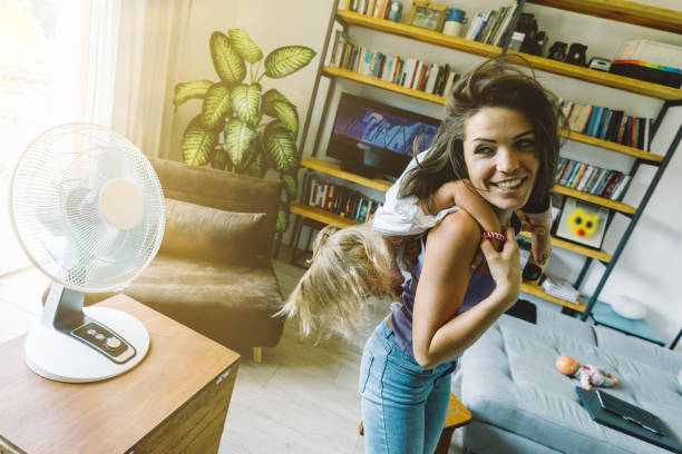 istock Hot day, playful fan dances, wise mother 1616137529