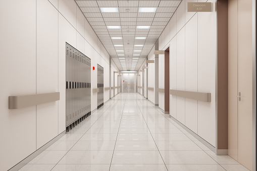 Empty School Corridor With Lockers And Closed Classroom Doors