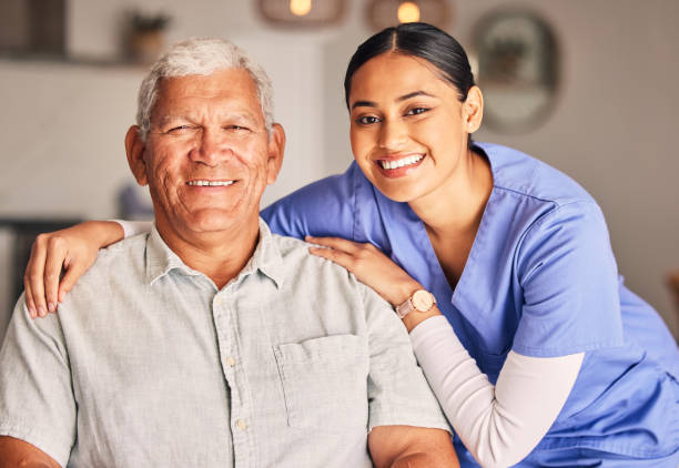 Happy woman, nurse and portrait of senior man with support, medical service and helping patient in retirement. Face of caregiver, elderly person and smile for trust, healthcare and nursing home stock photo