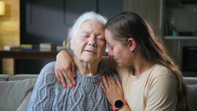 Support, daughter hug for a sad mother senior grandmother give empathy