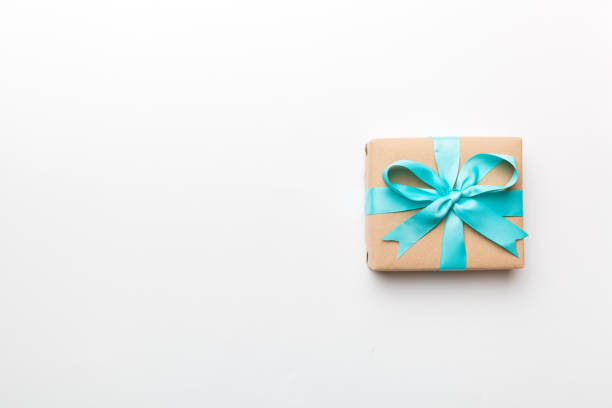 istock Holiday present box over colored background, top view. Copy space for design 1616231494