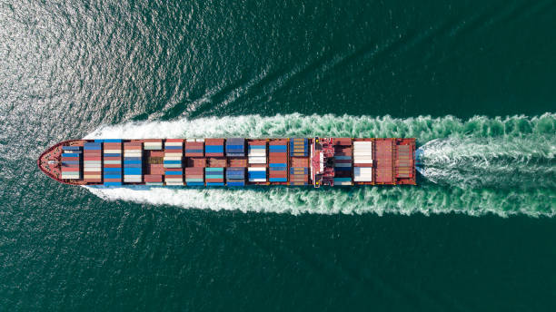 istock cargo container ship sailing full speed in sea to import export goods and distributing products to dealer and consumers worldwide, by container ship Transport business delivery service, aerial view 1616240358