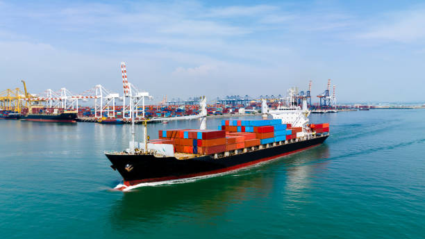 istock container cargo ship import export global business and industry commercial trade logistic and transportation of international by container cargo ship in the open sea, Container cargo freight shipping, front view drone shot, 1616240778