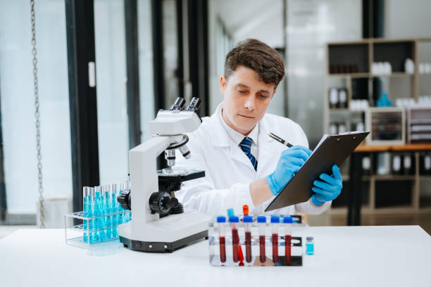 istock Modern medical research laboratory. female scientist working with micro pipettes analyzing biochemical samples, advanced science chemical laboratory 1616256409