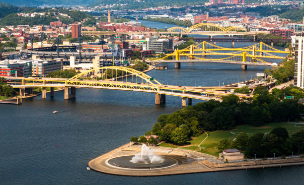 view of point state park and bridges in pittsburgh where the three rivers come together - pnc park imagens e fotografias de stock
