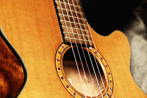 Nylon-string classical guitar with body cutaway, making it useful for pop and flamenco styles.