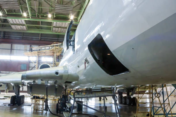 istock White passenger aircraft in the hangar 1616299972