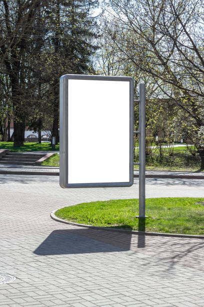 istock Blank mock up vertical billboard street poster on city background. 1616311775