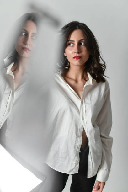 istock Female Staring At A Reflection Of Her Own Self 1616311790