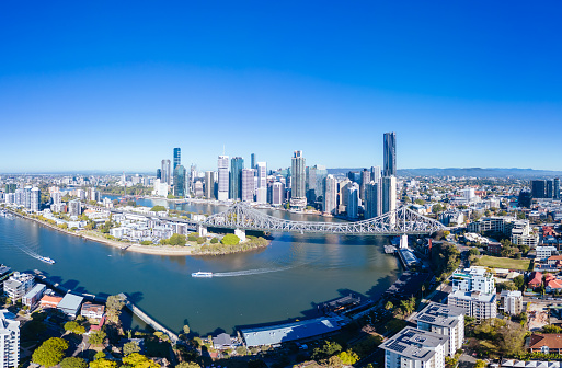 High altitude view of Brisbane skyline and Story Bridge from the suburb of New Farm and Wilson Outlook Reserve on a sunny winter's morning in Queensland, Australia.