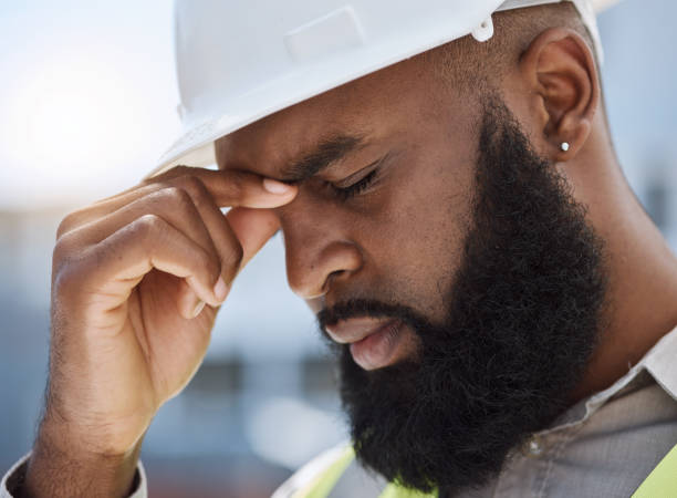istock Face of sad man, construction worker and headache for renovation, civil engineering mistake and stress. Confused, tired and anxiety of African builder in burnout, crisis and architecture problem 1616344239