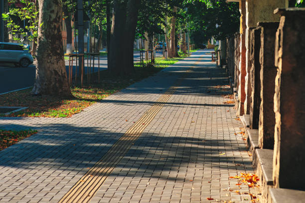 istock Sidewalk in the city park 1616349066