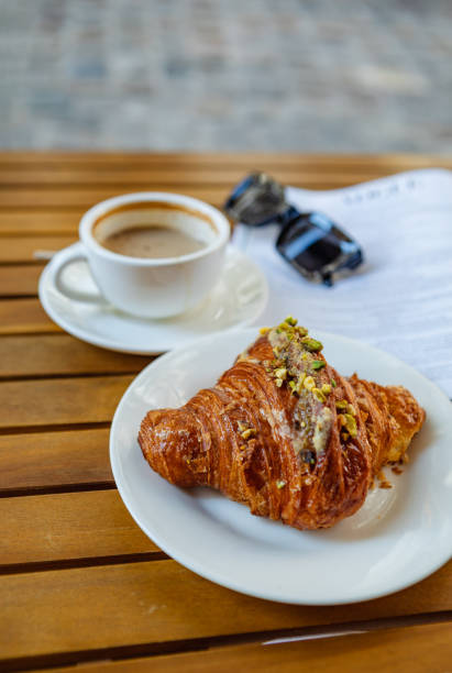 istock With croissants and coffee on the cafe's summer terrace 1616355382