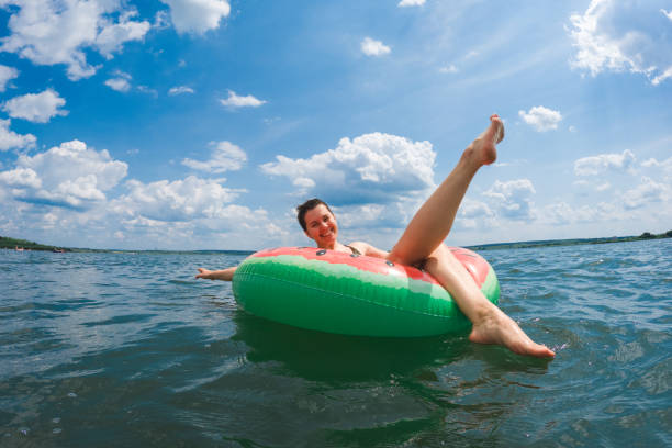 istock happy woman chilling on inflatable pool floats 1616355568