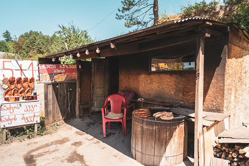 Surami/ Gürcistan - July 29.2023: Food stalls of street food vendors selling roadside Nazuki sweet bread on Surami street.Georgia
