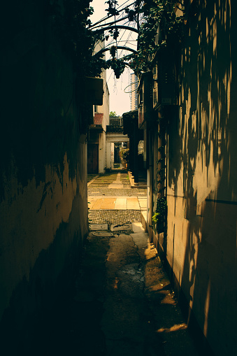 A narrow alley,  The sunlight falls, forming mottled spots of light.Shot in an ancient town in southern China