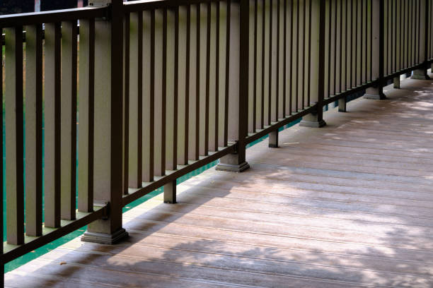 A partial closeup of a wooden bridge corridor