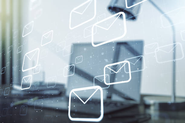 istock Creative concept of postal envelopes illustration on modern laptop background. Email and communications concept. Multiexposure 1616395756
