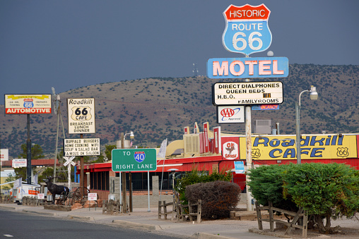 Barstow, California, United States - August 31, 2023: Roy's Cafe Sign in Barstow, California, with a palm tree in the background