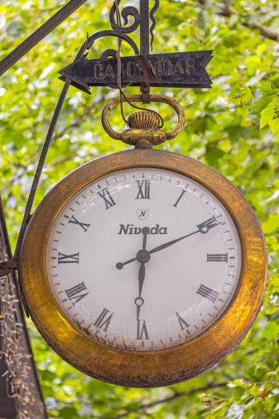 Belgrade, Serbia - July 20, 2023: Swiss Made Nivada Grenchen Old Gold Pocket Watch Hanging at King Alexander Boulevard.