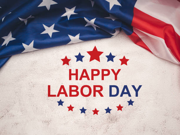 istock Happy labor day text over a cement floor and American Flag 1616406426