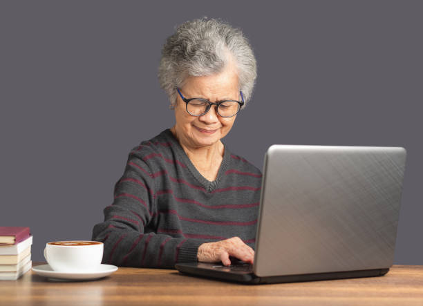 istock An elderly Asian woman using a laptop for searching data on the internet 1616421505