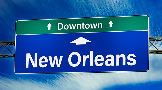 Road sign indicating direction to the city of New Orleans.