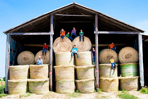 Young Cowgirls Eating Lunch On Top Of  A Water Tank