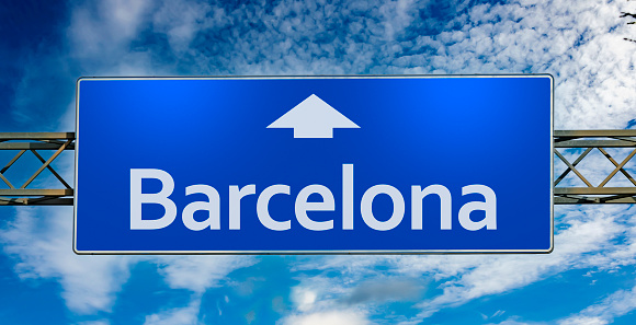 Road sign indicating direction to the city of Barcelona.
