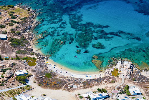 Aerial view of the secluded Kavos beach with turquoise sea at Naxos island, Cyclades, Greece