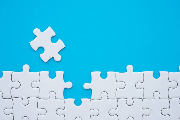 istock The last piece of jigsaw puzzle to complete task on blue background. 1616472264