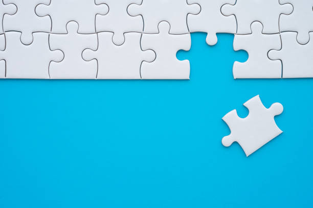 istock The last piece of jigsaw puzzle to complete task on blue background. 1616472670