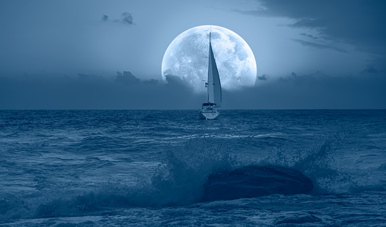 Lone yacht with Super Full Moon \