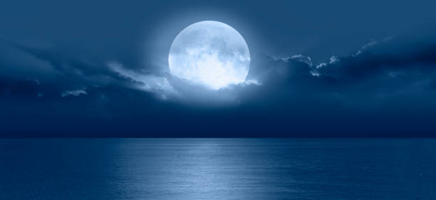 istock Night sky with full moon in the clouds 1616481371