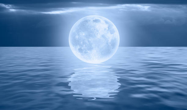 istock Night sky with full moon on the sea 1616481919
