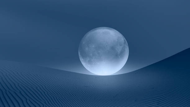 istock Full glass moon (or crystal ball moon) rising over desert at dusk 1616485934