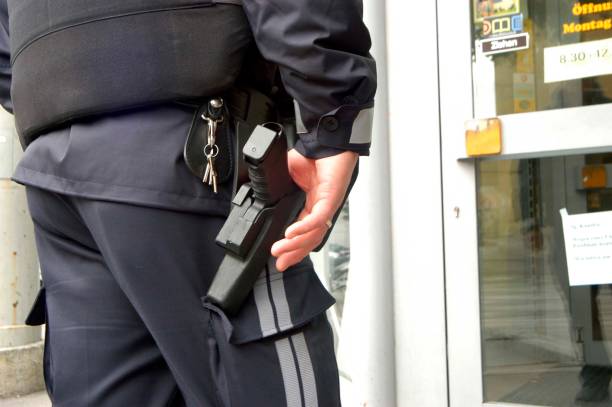 istock police officer with service weapon 1616490264