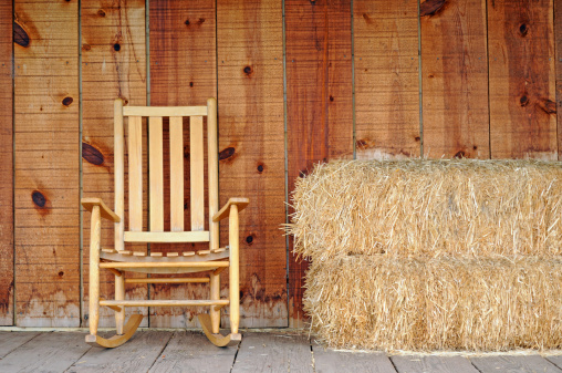 Rocking chair and hay stack on the front porch.