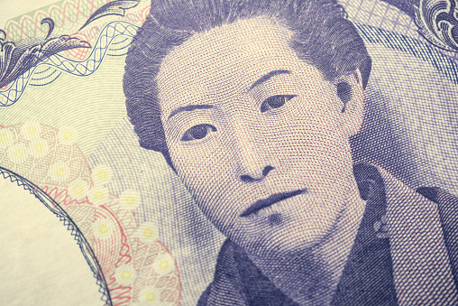 Close up macro of ichiyo higuchi on 5000 Japanese yen banknote texture background. Concept of Japanese yen payment currency of Japan, Forex investment, stock market or Asia global financial economic.