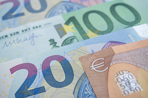 Macro shot focus on the euro sign on money cash euro banknote background. The currency of the euro country area and institutions. European Union (EU) financial economic and investment, forex or UK Brexit concept.
