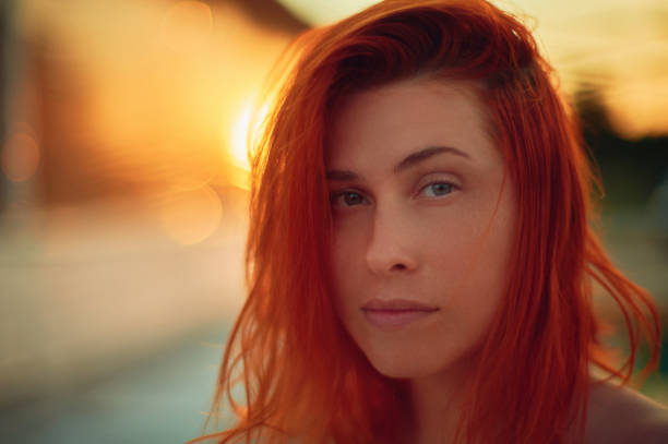 Red haired young woman closeup portrait