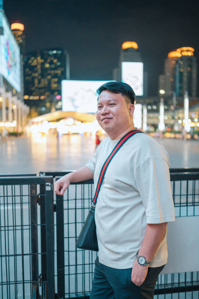 Happy plus size asian men enjoying night life
