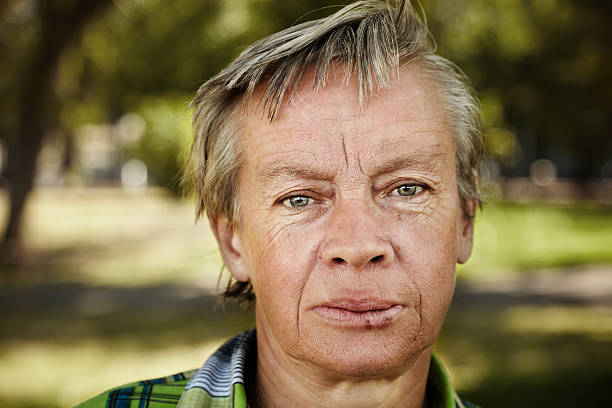 Portrait of a homeless woman in hardship stock photo