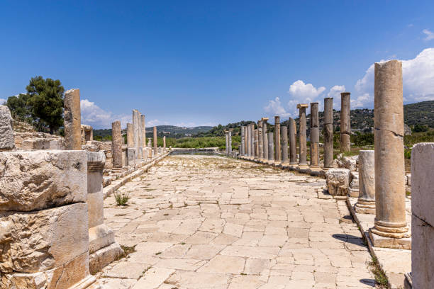 Patara City ancient ruins on Harbour Street. Patara City is outside of Kalkan City on Turkey's coast. Patara was founded in the 5th century BC. and became the largest port of Lycia. Antalya, Turkey ruinas antiguas de la ciudad de patara en harbour street. la ciudad de patara está fuera de la ciudad de kalkan, en la costa de turquía. patara fue fundada en el siglo 5 ac. y se convirtió en el puerto más grande de licia. antalya, turquía