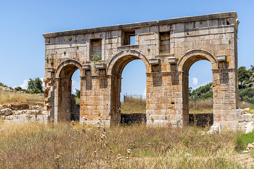 The ancient Roman gate at the northern edge of the ruins of Patara City, Antalya, Turkey