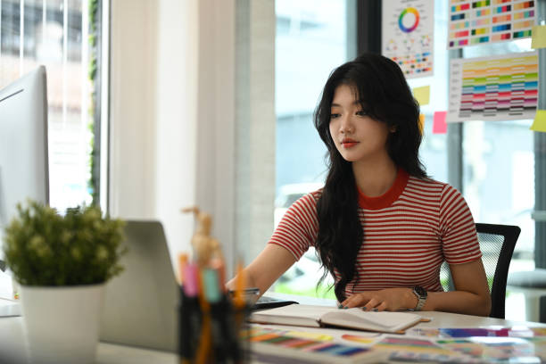 istock Young graphic designer woman working on workspace. 1616610719