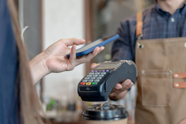 istock Woman use smartphone to scan QR code to pay in cafe restaurant with a digital payment without cash. Choose menu and order accumulate discount. E wallet, technology, pay online, credit card, bank app. 1616630302